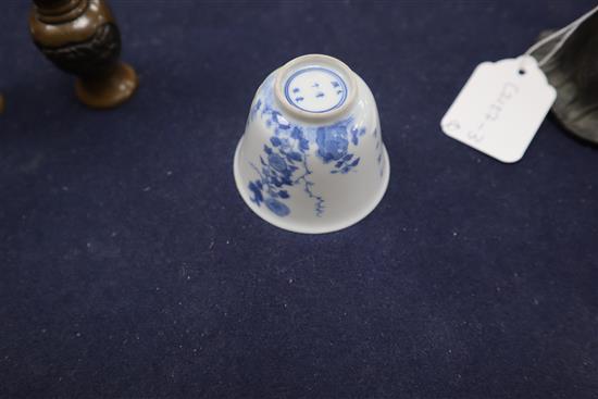 A Chinese bronze bell, a pair of miniature bronze vases and a blue and white cup with Kangxi mark tallest 15cm